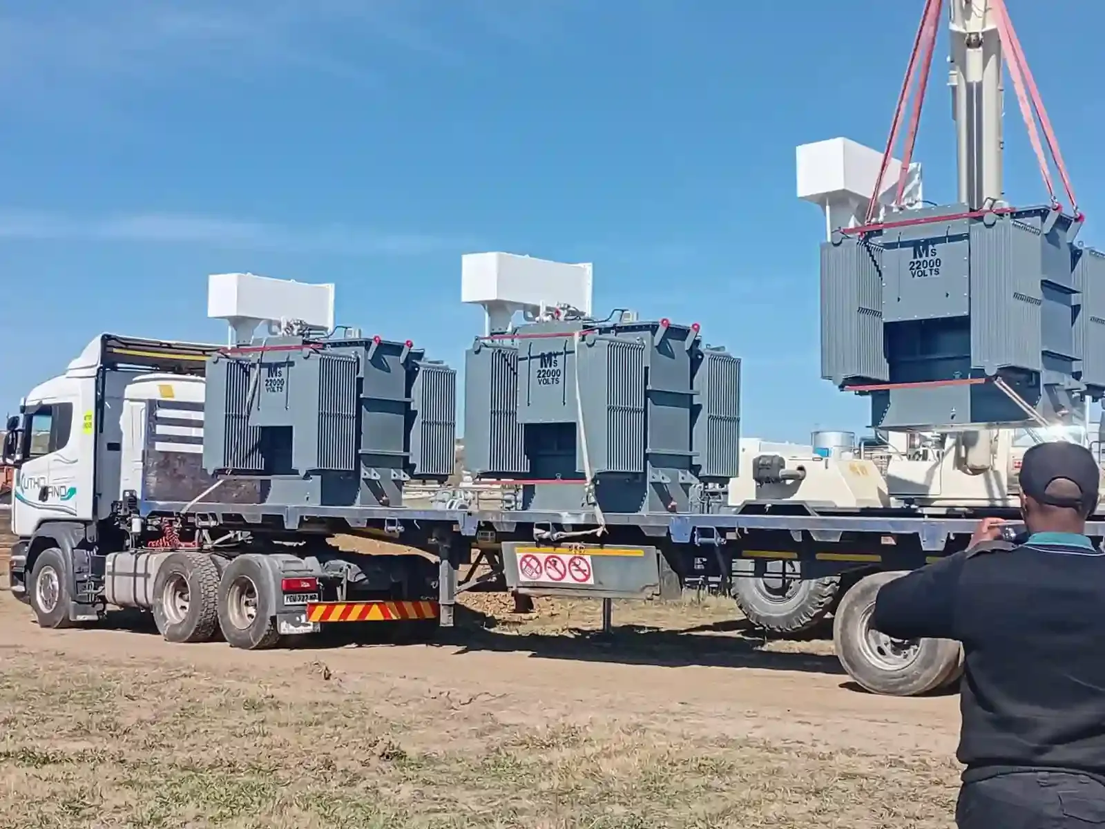 Nkuthobano transporting and positioning electrical transformers
